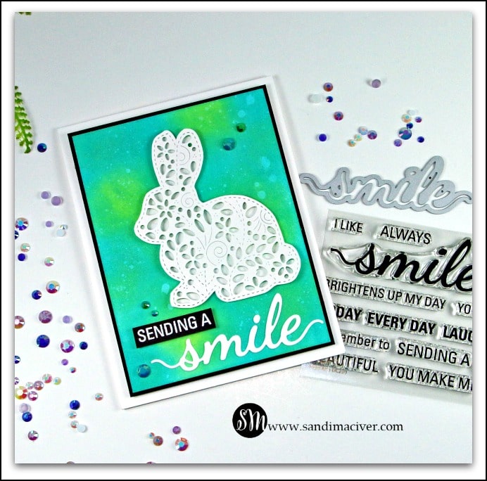 hand made easter card in green and blue with a filigree bunny using card making products from Simon Says Stamp