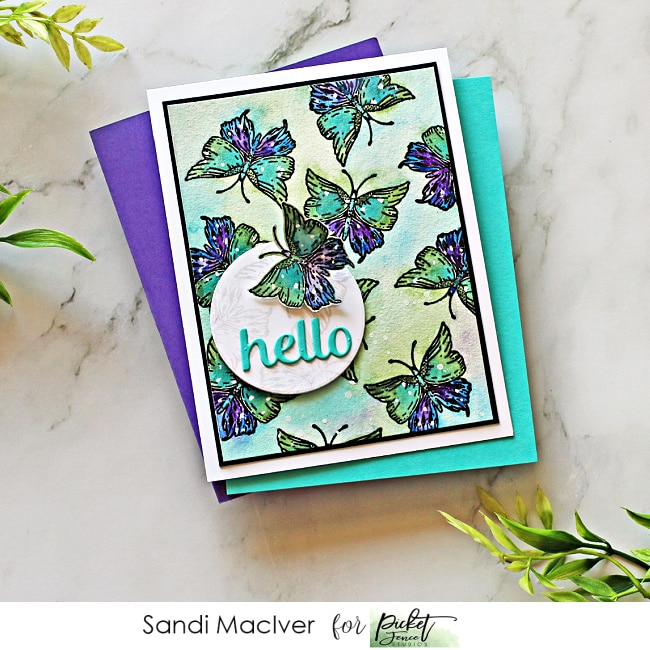 picture of a handmade card covered in butterflies in blue and purple