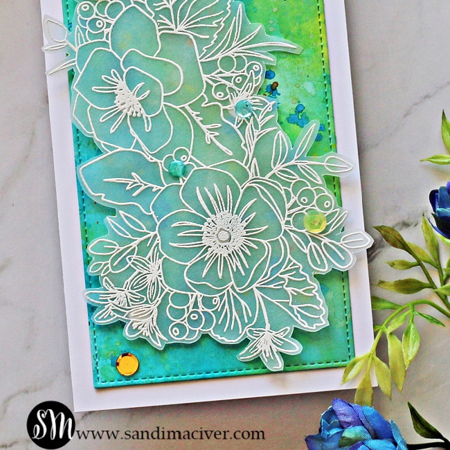 picture of the Simon Says Stamp Friendly Flowers stamp white embossed on Vellum 