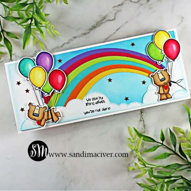 handmade slimline card with a rainbow and two bears holding balloons using stamps and cardmaking products from Trinity Stamps