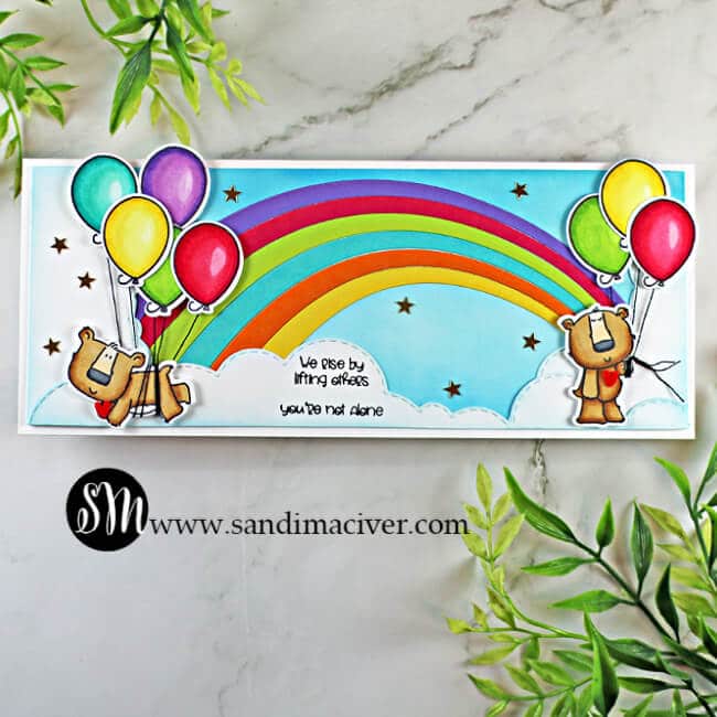 handmade slimline card with a rainbow and two bears holding balloons using stamps and cardmaking products from Trinity Stamps