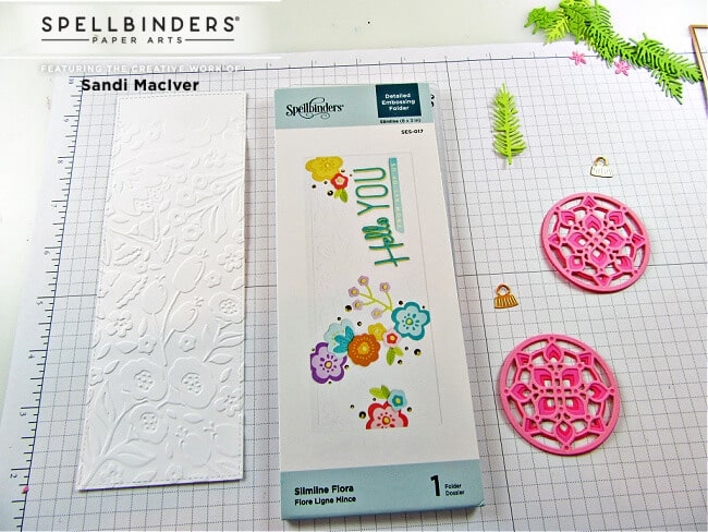 using the Spellbinders Slimline Flora Embossing Folder to create the card background