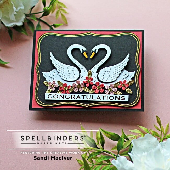 handmade card with two die cut swans and flowers using dies from Spellbinders