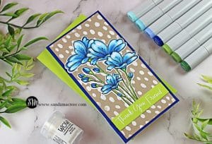 handmade greeting card with blue flowers and a white polka dot background with cardmaking supplies from Simon Says Stamp