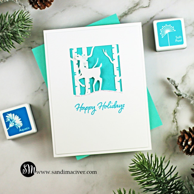 handmade blue and white card with a silhouette deer created with new die cutting paper crafting tools from Hero Arts