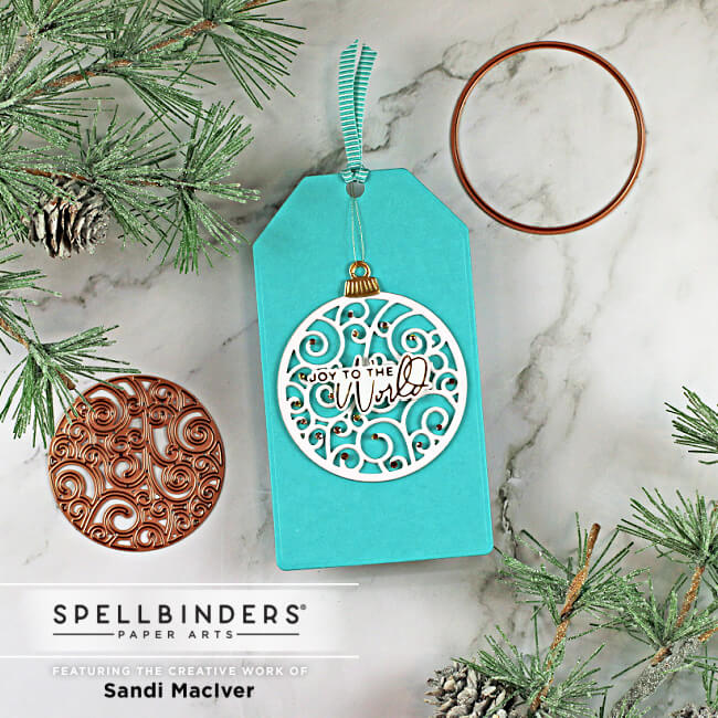 christmas gift tag with a decorated die cut ball on the front using dies from Spellbinders