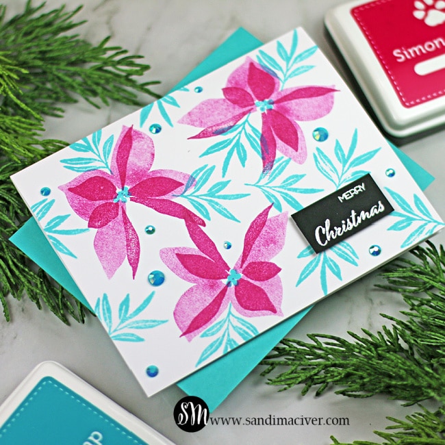 handmade christmas card with pink poinsettias and blue leaves using new paper crafting products from Simon Says Stamp