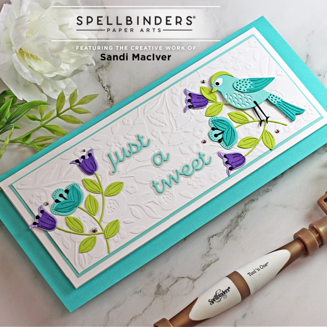 handmade slimline card with a bird and flowers created with paper crafting dies from Spellbinders