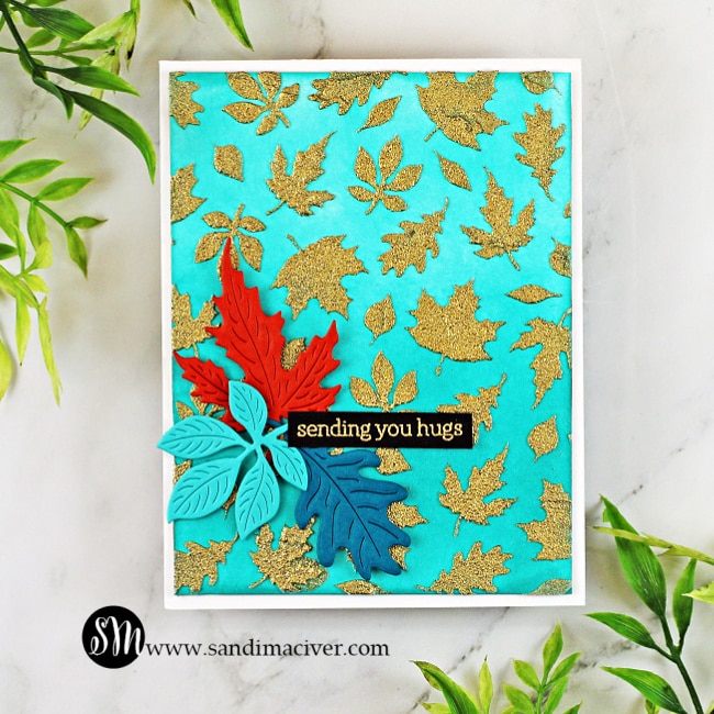 handmade card covered in fall leaves using stencils and dies from Hero Arts