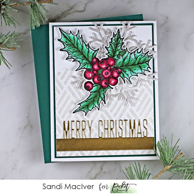 handmade christmas card in green and white with holly and a snowflake created with paper crafting products from Picket Fence Studios