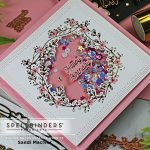handmade card in pink and white with glimmer foil crest and shaker created with paper crafting products from Spellbinders