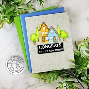 handmade new home greeting card with little houses and trees on it using card making products from Hero Arts