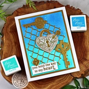 handmade card in blue and green with hearts created with cardmaking products from Hero Arts