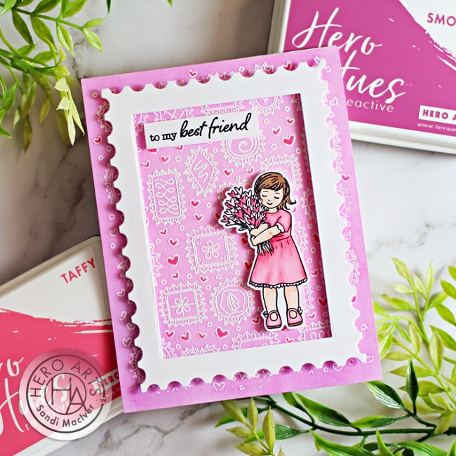 handmade pink valentines card with a little girl holding flowers created with card making supplies from Hero Arts