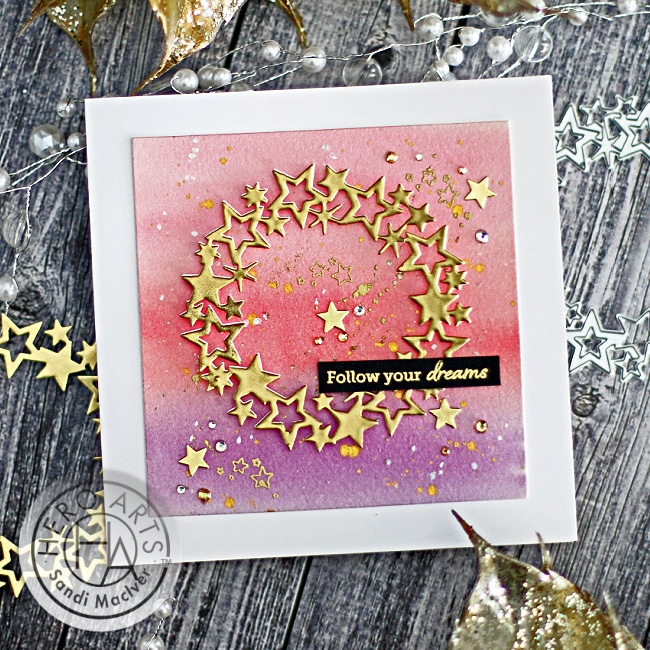 handmade card with a pink water colored background and a gold embossed star wreath using new card making products from Hero Arts