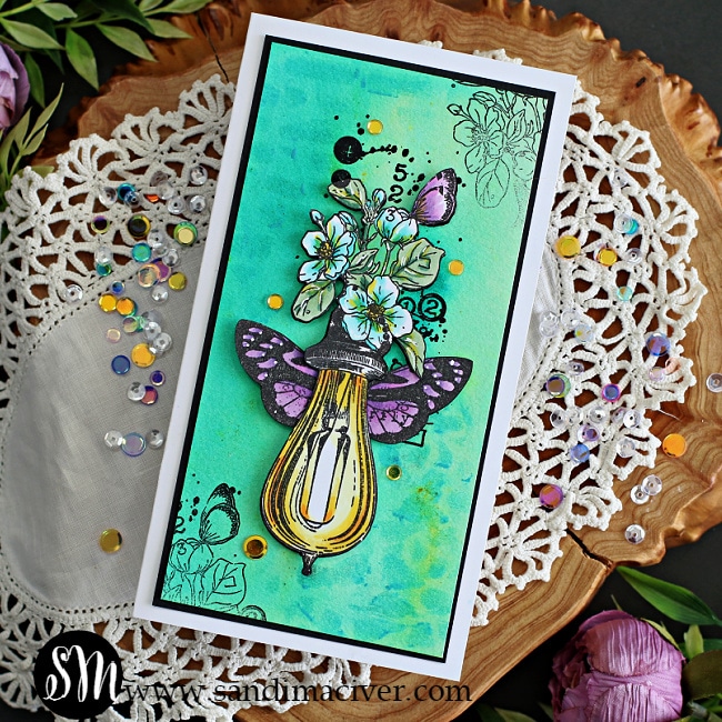 Mini Slimline greeting card created with a watercolor background and a colored image of a light bulb, flowers and butterflies using card making products from AALL & Create and available through Simon Says Stamp