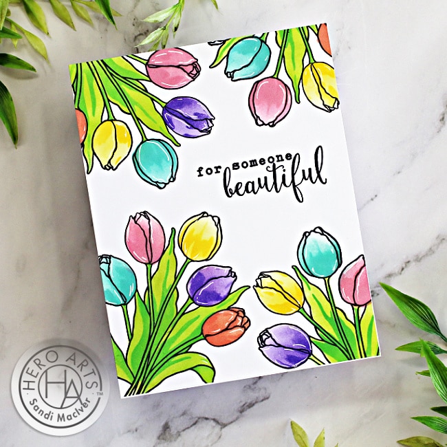 Single layer handmade greeting card with a rainbow of tulips using the Color Layering Stencils for card making from Hero Arts