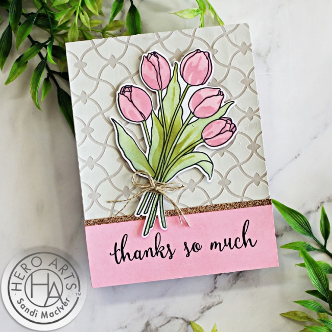 pink and taupe hand made greeting card with pink tulips over a embossing paste stenciled background using the Tulip Bouquet Color Layering Stencils card making products from Hero Arts