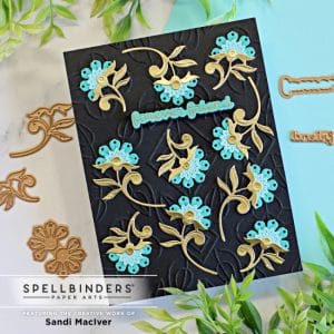 handmade card in black blue and gold covered in flowers using new card making supplies from Spellbinders