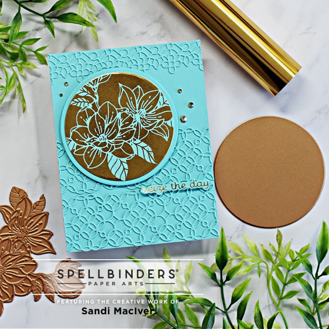 handmade blue card with a gold glimmer foil flower created using new card making products from Spellbinders