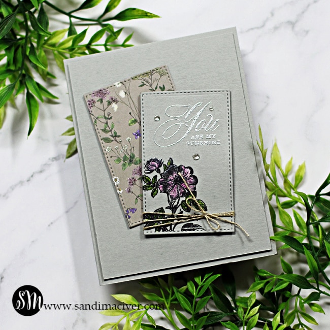 handmade card with purple flowers in two die cut panels using new cardmaking supplies from Simon Says Stamp