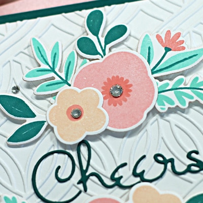 hand stamped card with pink and peach florals created using new card making products from Spellbinders