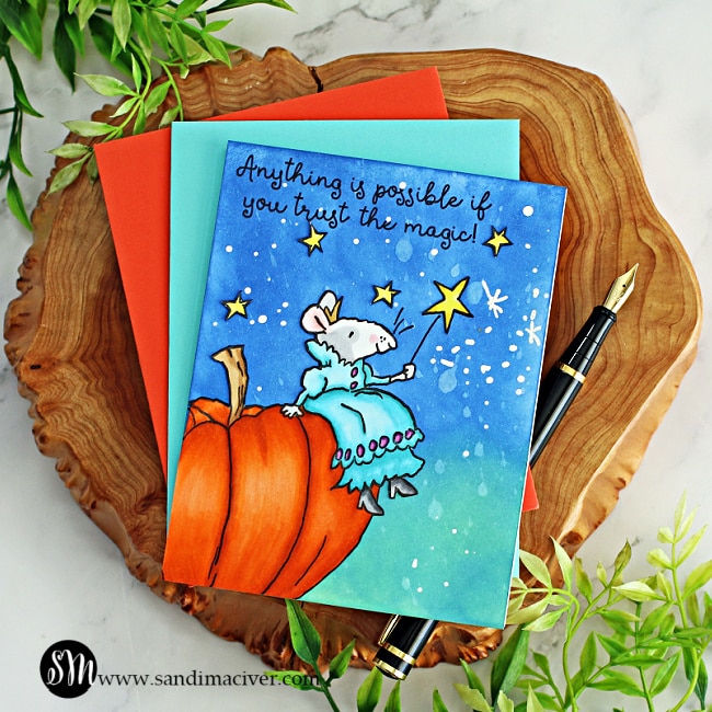 hand made greeting card with a little mouse sitting atop a beautiful pumpkin with her magic wand created using new card making products from Colorado Craft Company