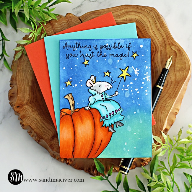 hand made greeting card with a little mouse sitting atop a beautiful pumpkin with her magic wand created using new card making products from Colorado Craft Company