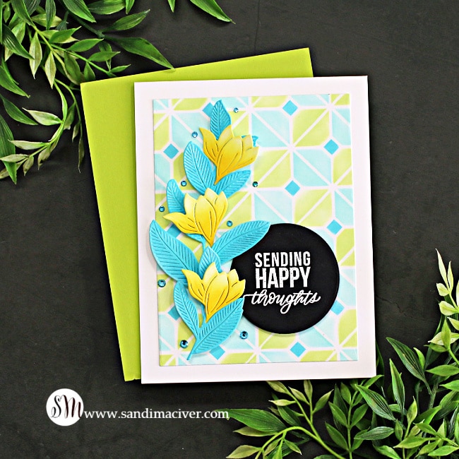 handmade card with a blue and yellow stenciled background and blue and yellow die cut flowers using card making supplies from Simon Says Stamp