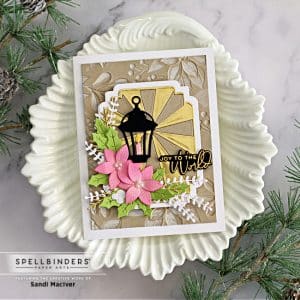handmade christmas card with die cut lamp and poinsettia created with new card making supplies from Spellbinders