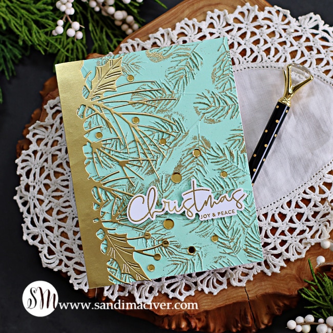 green and gold christmas card with gold embossing and a gold overlay, created with card making products from Simon Says Stamp