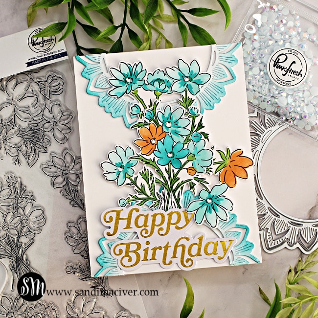 handmade greeting card with a white base and blue and orange florals created with new card making supplies from Pinkfresh