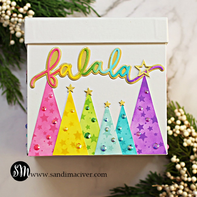 rainbow colored christmas trees around a white gift box created with new card making supplies from Simon Says Stamp