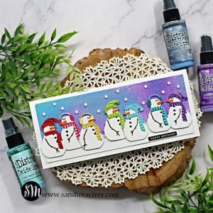 Slimline birthday card covered with a rainbow of die cut snowmen created with card making products from SImon Says Stamp