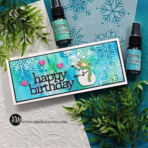 handmade slimline birthday card with a watercolor background, white embossed snowflakes and a little snowman