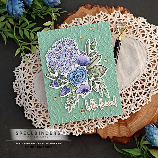 Green, Purple and BLue floral card with an embossed background created with new card making supplies from Spellbinders