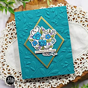 hand made teal colored card with a gold diamond and a floral bouquet in the center created with new card making supplies from Simon Says Stamp
