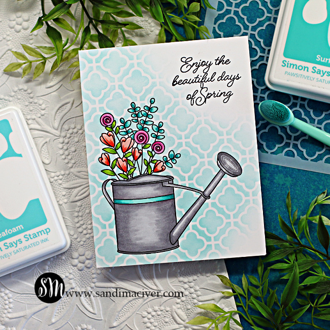 hand made greeting card with a watering call for of flowers on a stenciled blue background created with new card making products from Simon Says Stamp