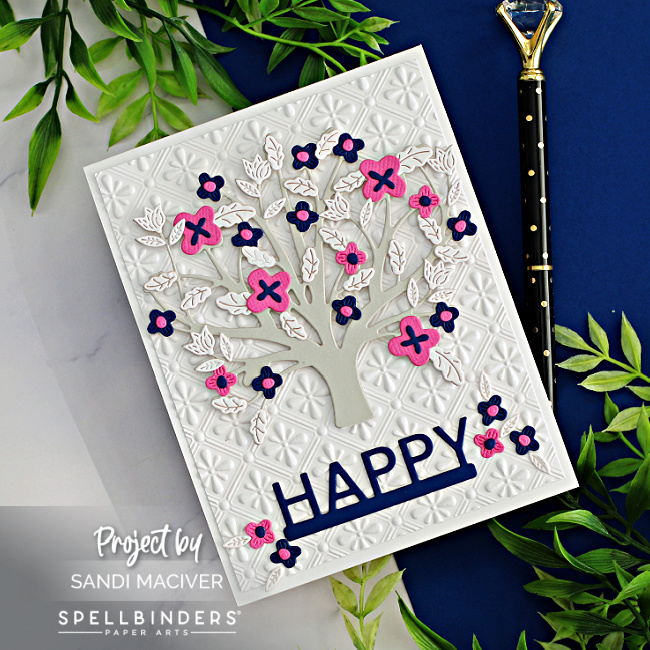 hand made card with a gray tree and pink and blue flowers created with new card making supplies from Spellbinders
