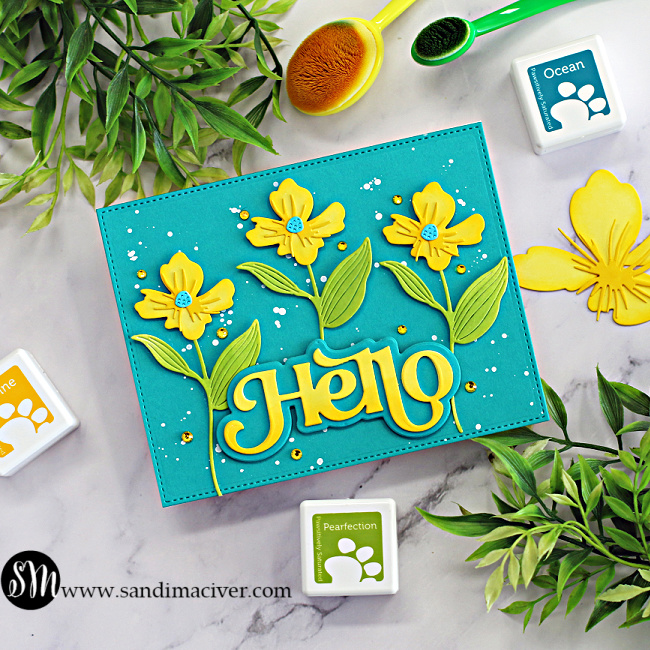 Layered Die Cuts for Card Making card 3 has 3 happy yellow flowers on a turquoise background with a big yellow HELLO sentiment