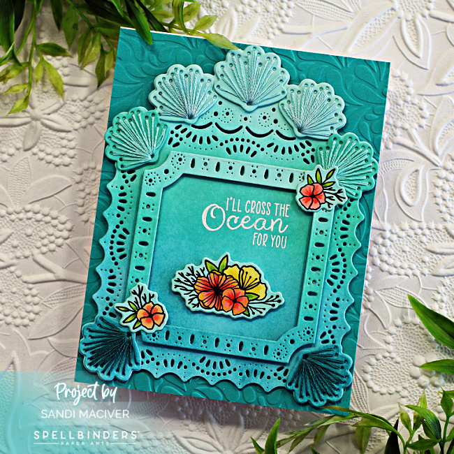 hand made greeting card with stitched sea shells, an die cut overlay and embossed background created with new card making supplies from Spellbinders