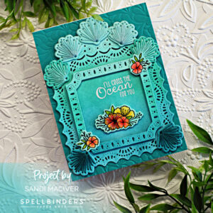 hand made greeting card with stitched sea shells, an die cut overlay and embossed background created with new card making supplies from Spellbinders