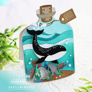 hand made greeting card in a bottle shape, with a sea bottom scene and an orca whale created with new card making dies from Spellbinders