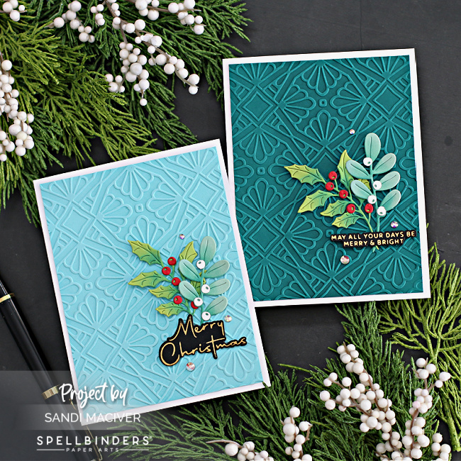 Blue and green hand made christmas cards with an embossed background and die cut foliage created with new card making products from Spellbinders