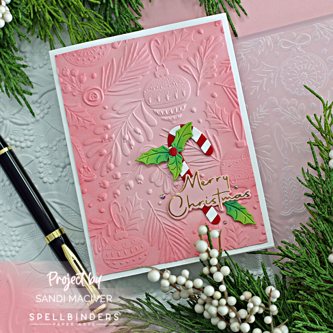 Embossed Pink Christmas Card with die cut foliage created with new card making supplies from Spellbinders