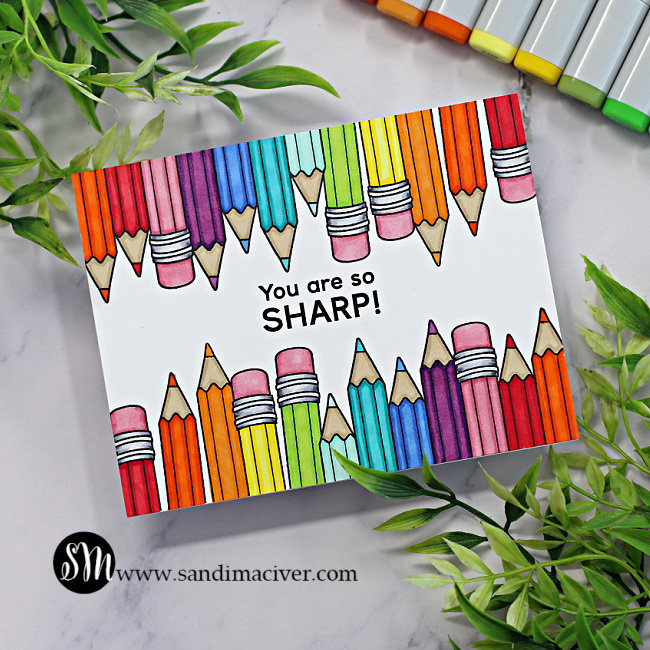 hand made teacher card with a rainbow of colored pencils across the top and bottom created with card making supplies from Simon Says Stamp