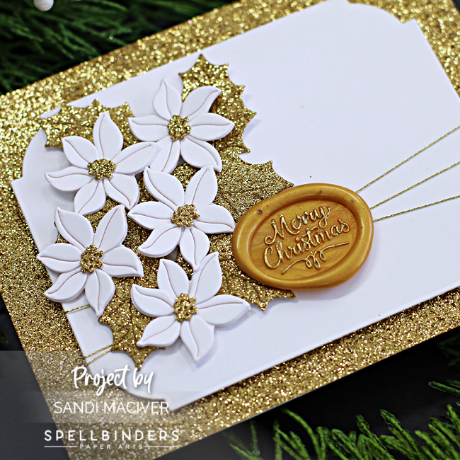 hand made christmas card in gold and white with die cut white poinsettias and gold leaves created with new card making products from Spellbinders 