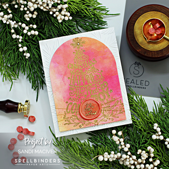 coral colored watercolor card with a gold embossed tree created with new card making supplies from Spellbinders