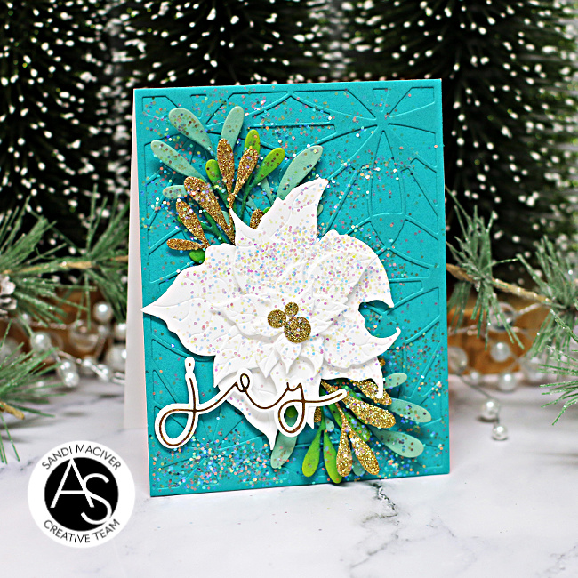 hand made christmas card with a teal base and a white poinsettia die cut using new card making supplies from Alex Syberia Designs