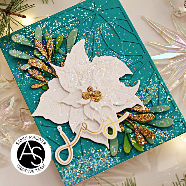 hand made christmas card with a teal base and a white poinsettia die cut using new card making supplies from Alex Syberia Designs